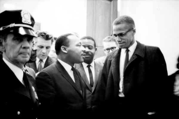 Martin Luther King and Malcolm X waiting for press conference.